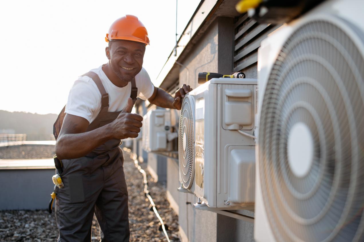 Professional HVAC technician inspecting air conditioning unit
