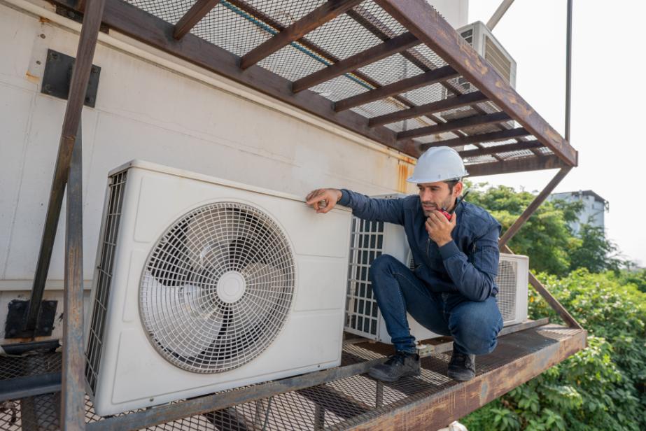 Skilled HVAC technician evaluating air conditioning system
